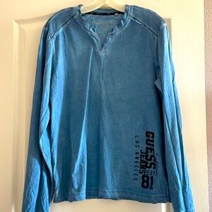 Guess long sleeve jersey tee shirt w Guess logo on front side.